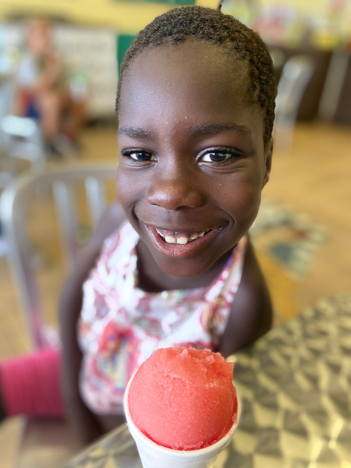 Girl smiling with Italian ice.